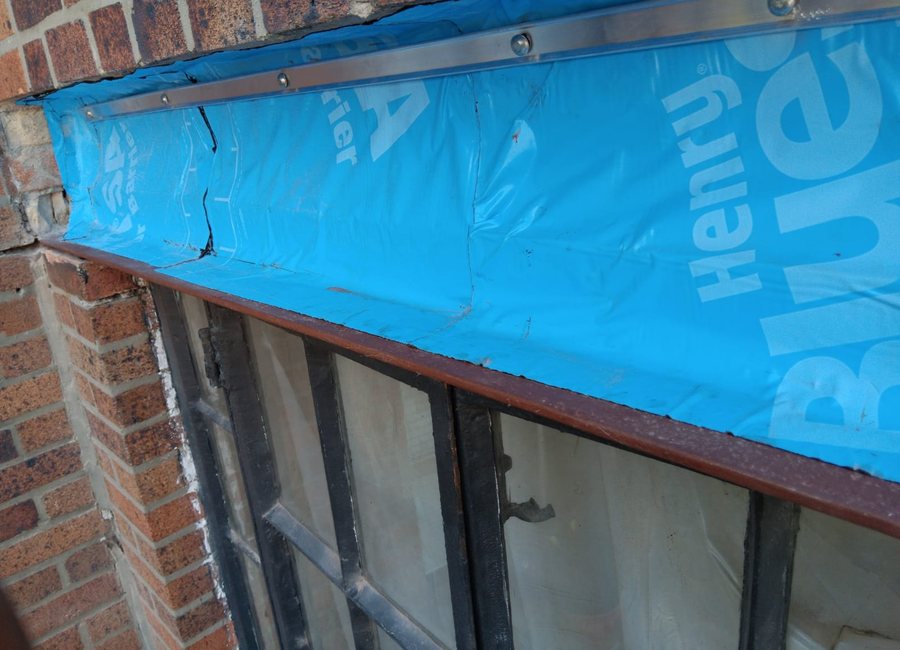 Window waterproofing detail with blue membrane